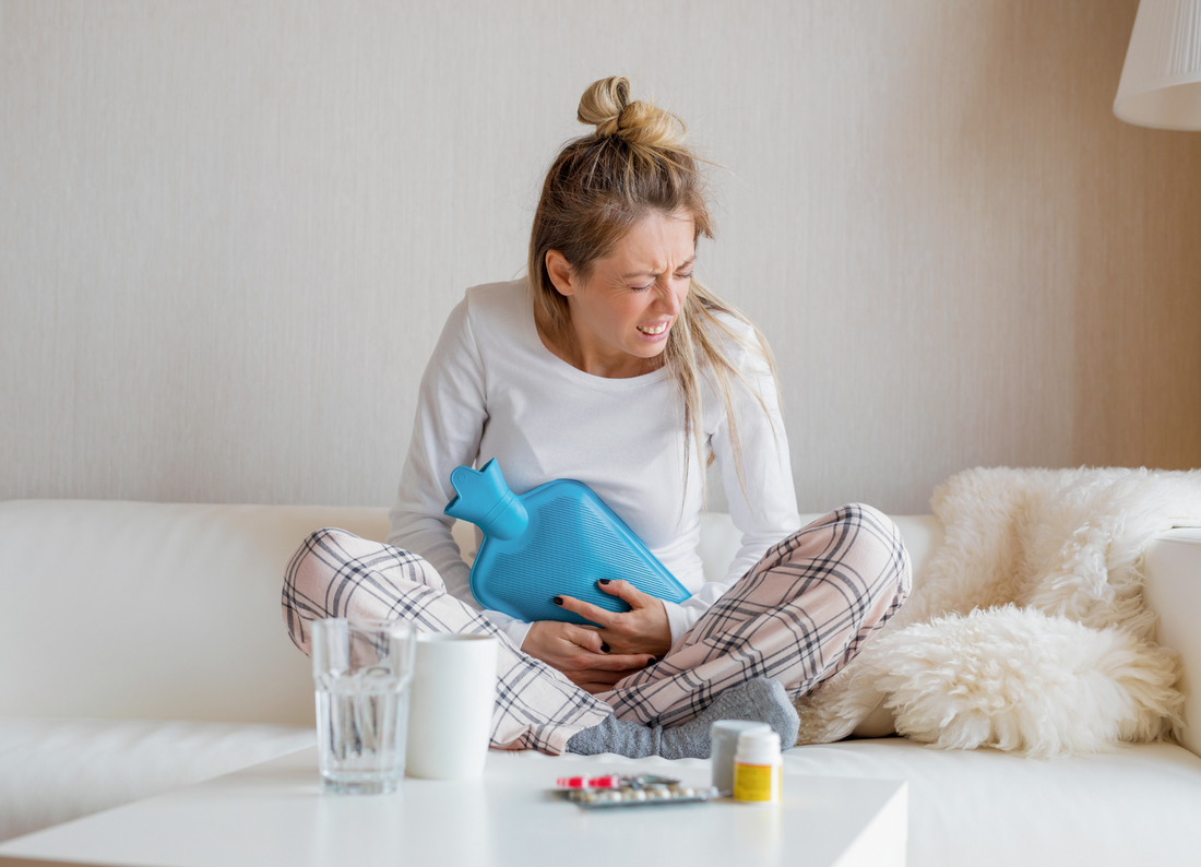 Women_with_Intersitial_Cystitis_or_Endometriosis_holding_heat_pad_to_stomach